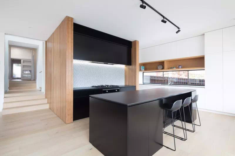 Black and timber kitchen of modular home
